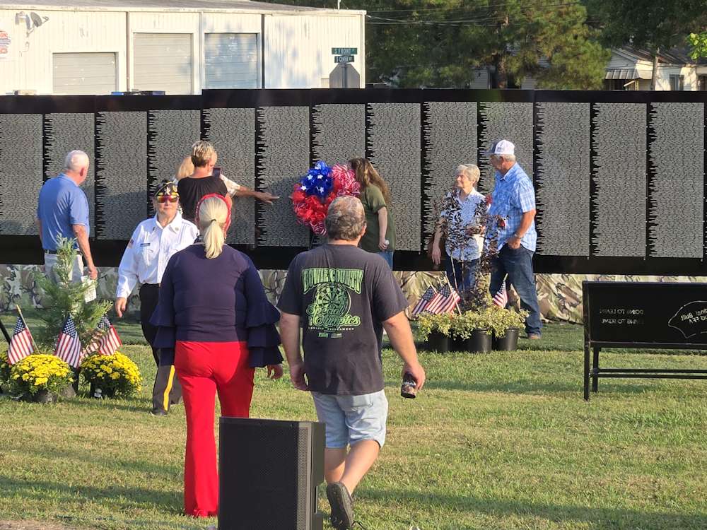 Escorting local family to Veteran's name on Wall Escorting local family to Veteran's name on Wall